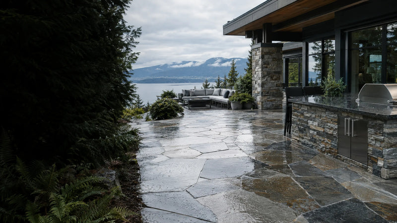 Sealed natural flagstone patio and granite outdoor countertop at a West Coast home on an overcast day